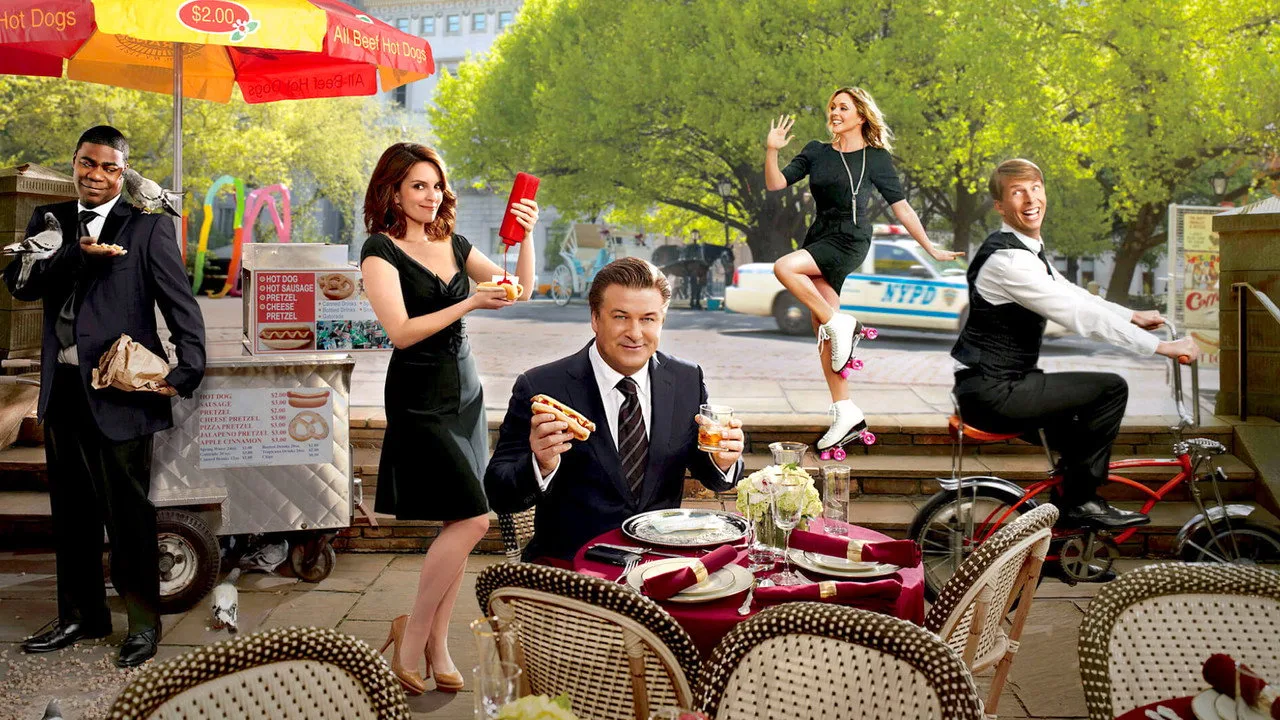 Grupo de fãs em leggings e tênis, segurando garrafas de água, assistindo a um televisor com logo da 30 Rock