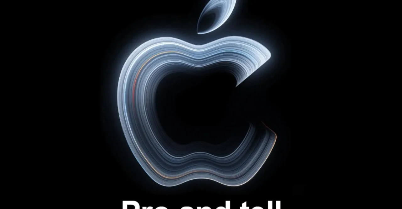 MacBook Pro com tela OLED exibido em palco, ao lado do logotipo da Apple e do calendário marcando 28/10