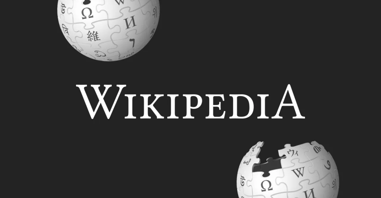 Funcionários da Wikimedia segurando cartazes com slogans de sindicalização em frente ao prédio da fundação