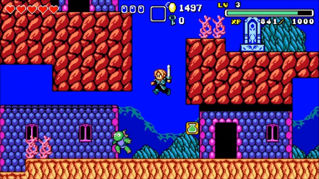 Controle de videogame sobre uma mesa com uma garrafa de água e uma toalha ao lado de um monitor exibindo pixel art