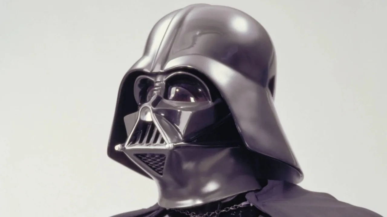 Miniatura de Darth Vader em pose arrogante ao lado do gerador de Hoth, com o cenário gelado da Batalha de Hoth da Kenner 1982