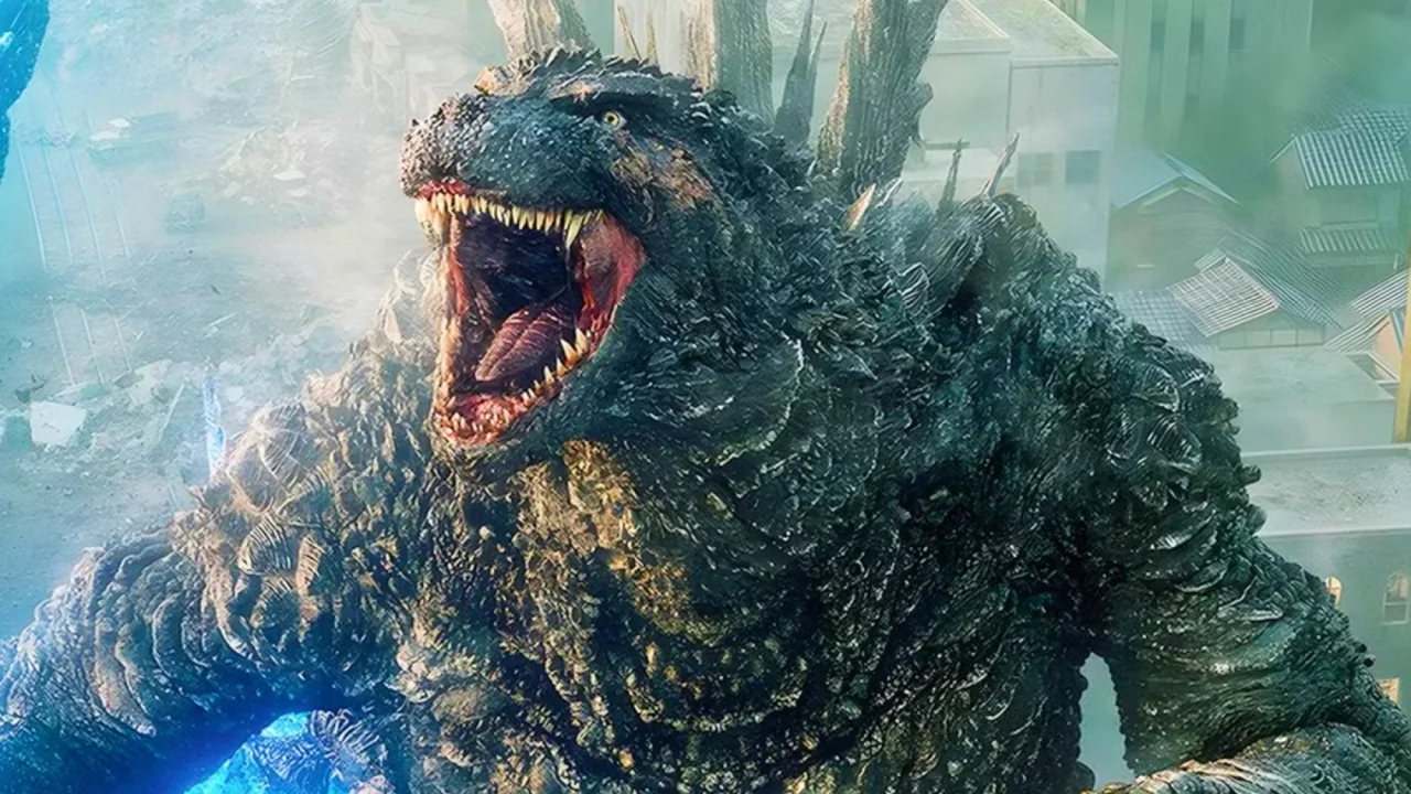 Halteres e garrafa d'água sobre mesa com manual do LEGO Godzilla 5.360 peças