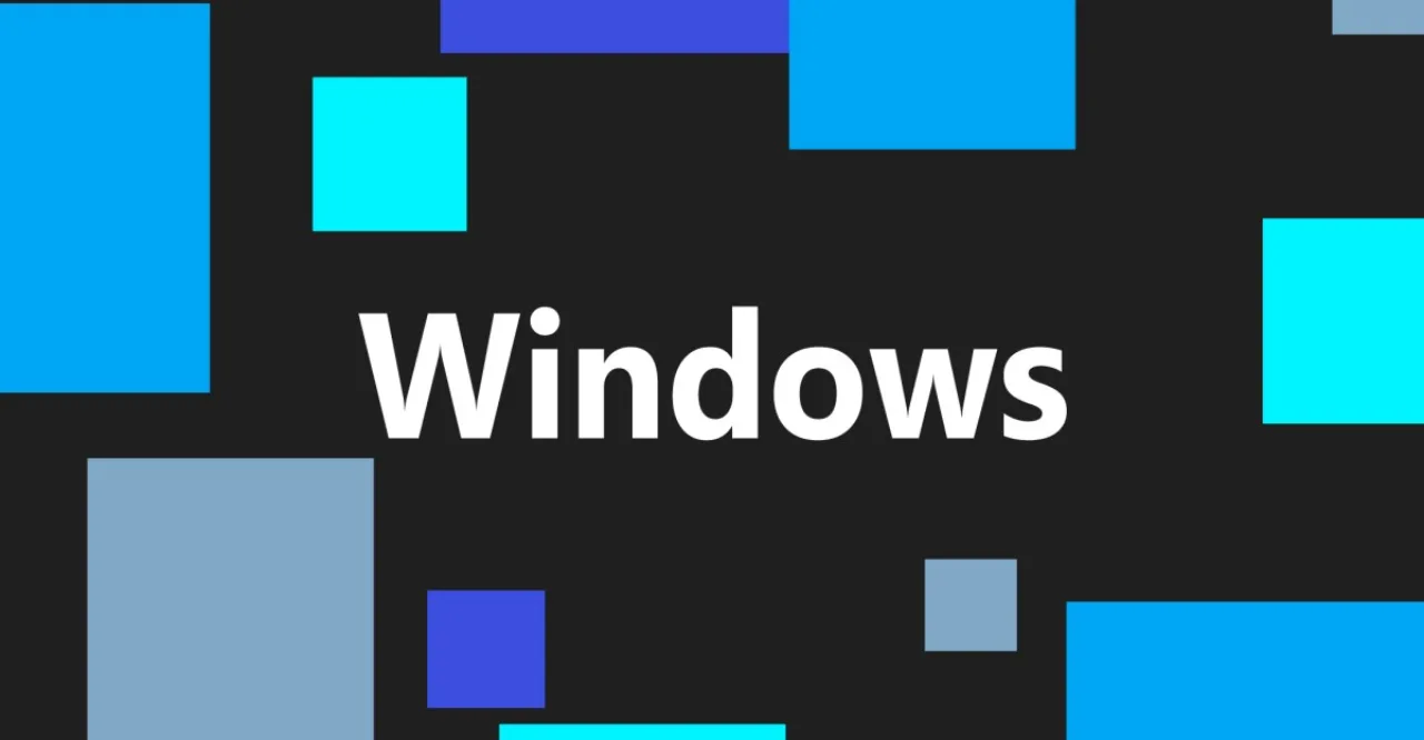 Pessoa no sofá, laptop aberto exibindo aviso de pausa indefinida de atualizações do Windows 11